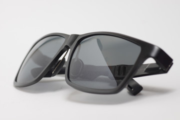 Black sunglasses on a white background