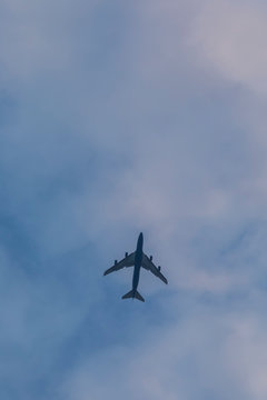 Airplane flying on a background of clouds