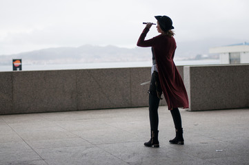 Woman disguised as a pirate scanning the horizon