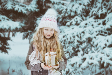 girl holding presents in hands