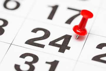 Pin on the date number 24. The twenty fourth day of the month is marked with a red thumbtack. Pin...