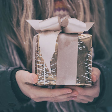 Girl Holding Presents In Hands