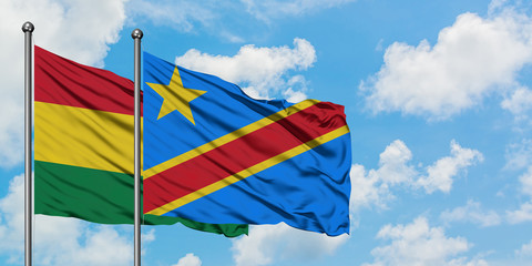 Bolivia and Congo flag waving in the wind against white cloudy blue sky together. Diplomacy concept, international relations.