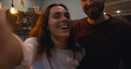 Phone camera POV couple or family having a video call with friends or family during Christmas holidays - Powered by Adobe