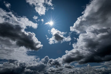 Fototapeta premium Sun shining in the cloudy sky.