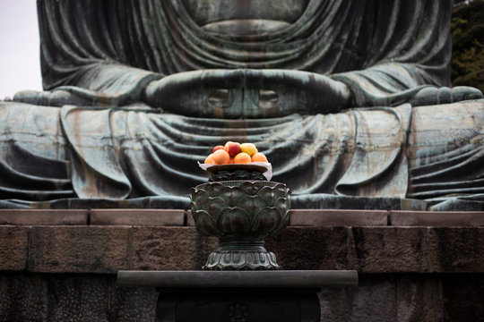 Fruit offerings to the Buddha of Kamakura, Japan