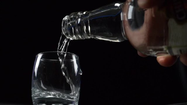 vodka is poured into a stack