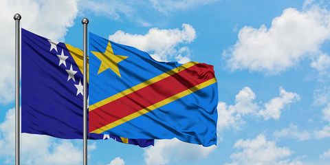 Bosnia Herzegovina and Congo flag waving in the wind against white cloudy blue sky together. Diplomacy concept, international relations.