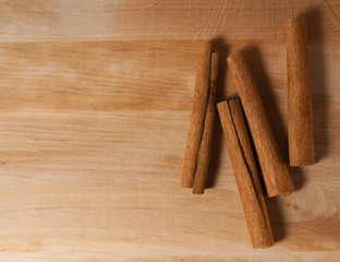 cinnamon sticks on a wooden board