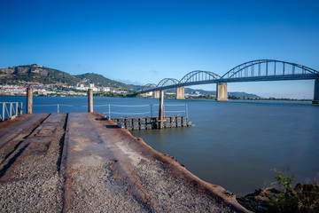Fototapeta na wymiar Long exposure landscape image of bridge Marechal Carmona on river Tejo in Vila Franca Xira, Portugal.