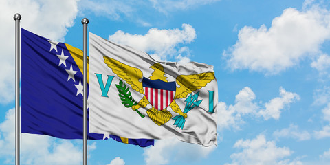 Bosnia Herzegovina and United States Virgin Islands flag waving in the wind against white cloudy blue sky together. Diplomacy concept, international relations.
