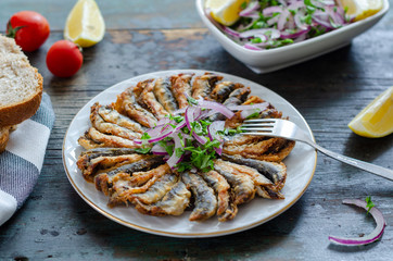 Fried anchovies fish and salad