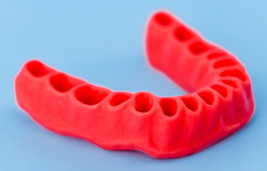 model of human gums without teeth isolated on blue