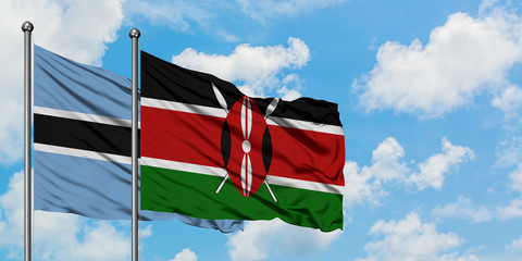 Botswana and Kenya flag waving in the wind against white cloudy blue sky together. Diplomacy concept, international relations.