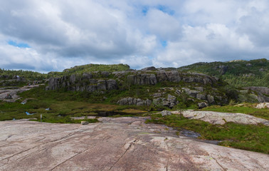 Mountains on the way to the Preachers Pulpit Rock in fjord Lysefjord - Norway - nature and travel background. Lake Tjodnane, july 2019