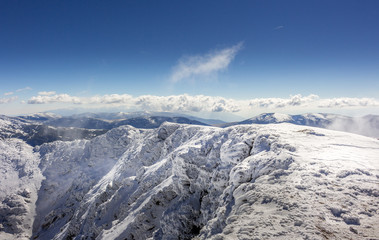 Beautiful winter landscape in the clouds at the Rila mountain in Bulgaria, Maliovica.