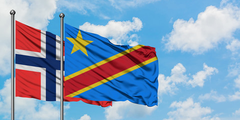 Bouvet Islands and Congo flag waving in the wind against white cloudy blue sky together. Diplomacy concept, international relations.