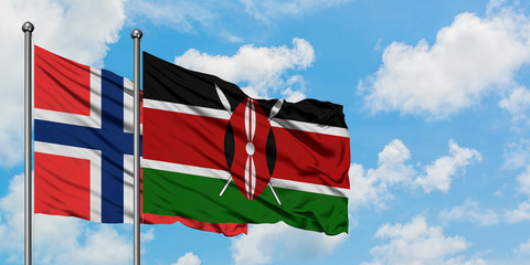 Bouvet Islands and Kenya flag waving in the wind against white cloudy blue sky together. Diplomacy concept, international relations.