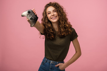 Pretty gamer girl on pink background © Anton Zabielskyi