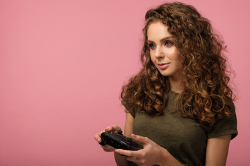 Pretty gamer girl on pink background