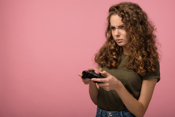 Pretty gamer girl on pink background