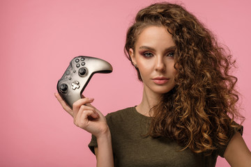 Pretty gamer girl on pink background © Anton Zabielskyi