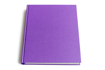 The top side of the purple hardcover book isolated on white background with copy space for text