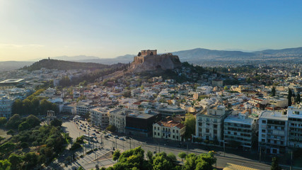 Obraz premium Aerial birds eye view photo taken by drone of iconic Acropolis hill and the masterpiece of ancient world the Parthenon and Dionysus theatre, Athens historic centre, Attica, Greece