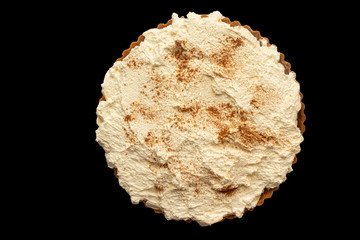 view of a large pumpkin pie topped with cream