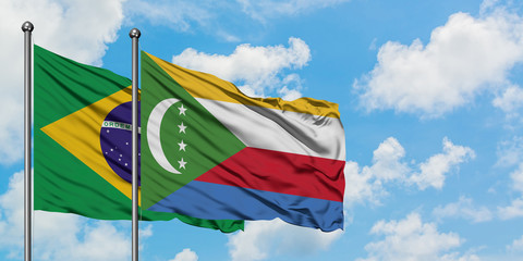 Brazil and Comoros flag waving in the wind against white cloudy blue sky together. Diplomacy...