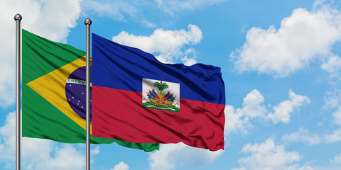 Brazil and Haiti flag waving in the wind against white cloudy blue sky together. Diplomacy concept, international relations.