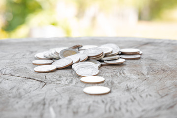 Thai baht money or Money Thai coins staircase sorted on wooden table. King of Thailand. The concept of financial planning, savings, Business successful