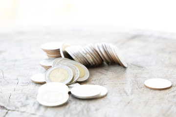 Thai baht money or Money Thai coins staircase sorted on wooden table. King of Thailand. The concept of financial planning, savings, Business successful