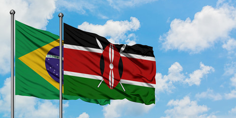 Brazil and Kenya flag waving in the wind against white cloudy blue sky together. Diplomacy concept, international relations.
