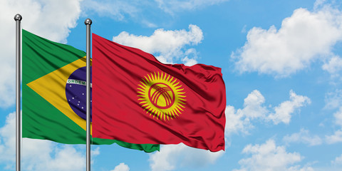 Brazil and Kyrgyzstan flag waving in the wind against white cloudy blue sky together. Diplomacy concept, international relations.