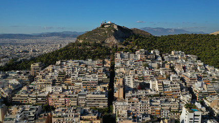 Aerial drone photo of iconic Lycabettus hill featuring uphill church of Saint George and...