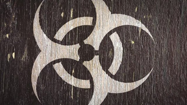 Biohazard Warning  Symbol On Wodden Texture. Ideal For Your Biological Danger Related Projects. High Quality Seamless Animation. 4K, 60fps.