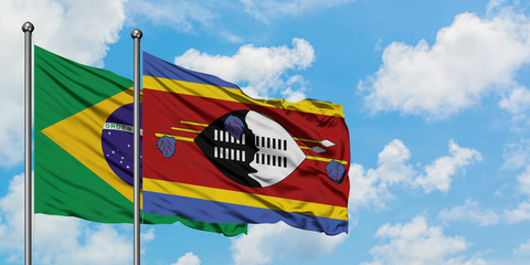 Brazil and Swaziland flag waving in the wind against white cloudy blue sky together. Diplomacy concept, international relations.