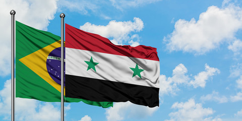 Brazil and Syria flag waving in the wind against white cloudy blue sky together. Diplomacy concept, international relations.
