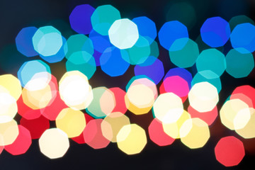 Abstract background with bright round bokeh on a dark blue background for New Year's design. Blur. Close-up