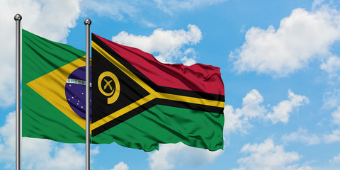 Brazil and Vanuatu flag waving in the wind against white cloudy blue sky together. Diplomacy concept, international relations.