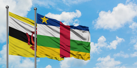 Brunei and Central African Republic flag waving in the wind against white cloudy blue sky together. Diplomacy concept, international relations.