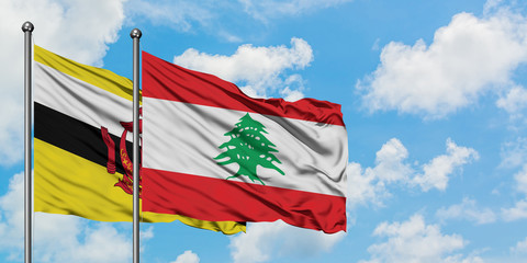 Brunei and Lebanon flag waving in the wind against white cloudy blue sky together. Diplomacy concept, international relations.