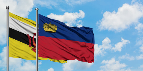 Brunei and Liechtenstein flag waving in the wind against white cloudy blue sky together. Diplomacy concept, international relations.