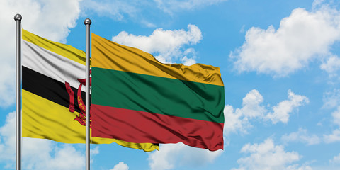 Brunei and Lithuania flag waving in the wind against white cloudy blue sky together. Diplomacy concept, international relations.