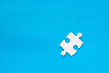 one white painted piece piece of jigsaw puzzle