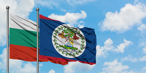 Bulgaria and Belize flag waving in the wind against white cloudy blue sky together. Diplomacy concept, international relations.