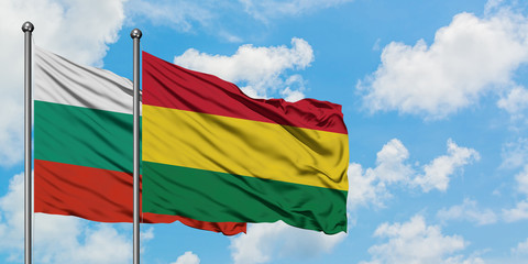 Bulgaria and Bolivia flag waving in the wind against white cloudy blue sky together. Diplomacy concept, international relations.
