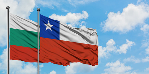 Bulgaria and Chile flag waving in the wind against white cloudy blue sky together. Diplomacy concept, international relations.