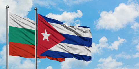 Bulgaria and Cuba flag waving in the wind against white cloudy blue sky together. Diplomacy concept, international relations.